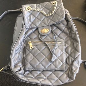 Grey backpack with multi functional uses